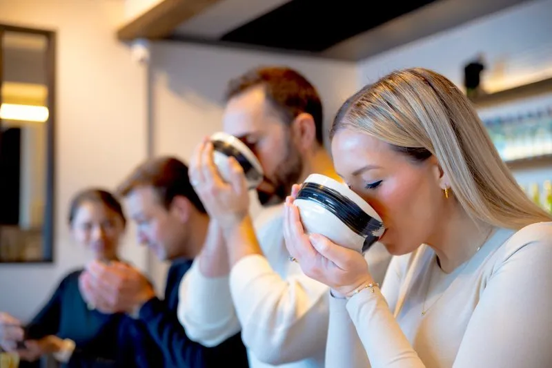 Guests enjoying matcha making class